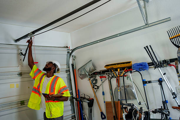 Professional Garage Door Spring Repair technician working in West Fargo, ND